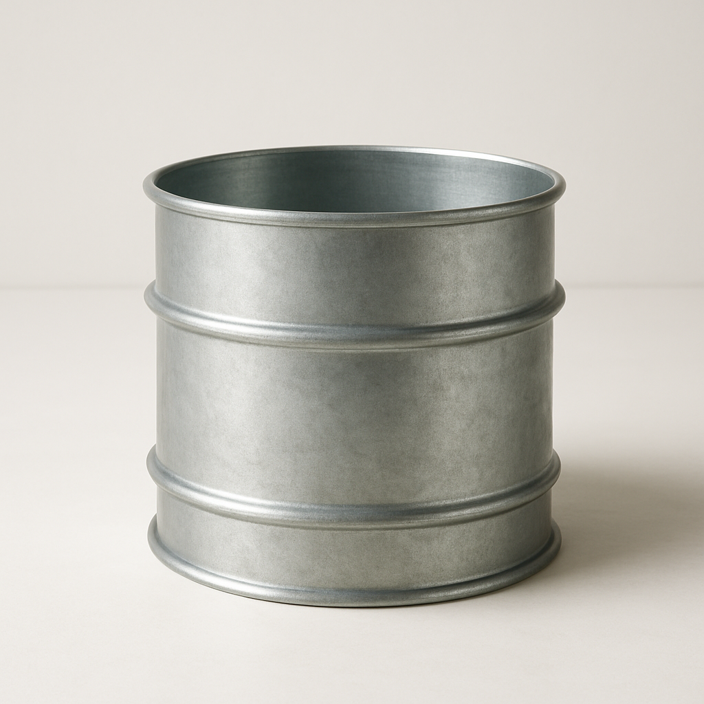 smooth round metal duct coupling laid on its side with rolled edges visible